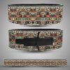 Colorful tribal pattern leather weightlifting belt featuring geometric and ethnic motifs in orange, teal, black, and beige tones with a black lever buckle.